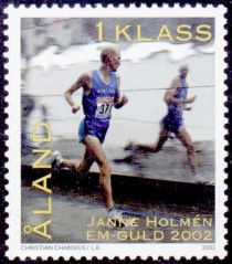 Janne Holmén runs past shop window