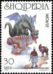 Dragon on rock looking at warrior, donkey