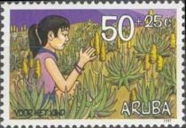 Girl sitting among aloe plants