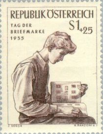 Young man with stamp album