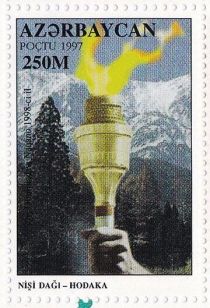 Olympic Torch on Background of Mount Nishi