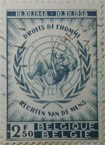 Emblem of the UN, two hands carrying a Child