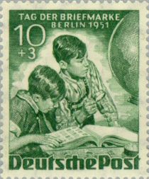 Boys with stamp album, globe