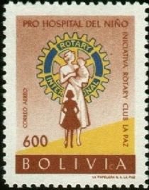 Rotary Emblem and nurse with children