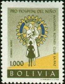 Rotary Emblem and nurse with children