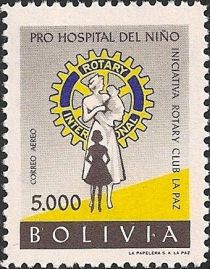 Rotary Emblem and nurse with children