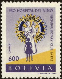 Rotary Emblem and nurse with children