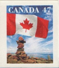 Canadian Flag and Inuit Cairn