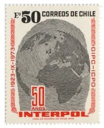 INTERPOL  50 years. Fingerprint over Globe