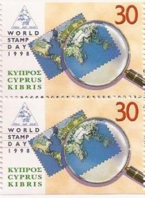 World Stamp Day '98 - Continents and a magnifying glass