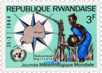 Map of Rwanda and Woman at Water Pump